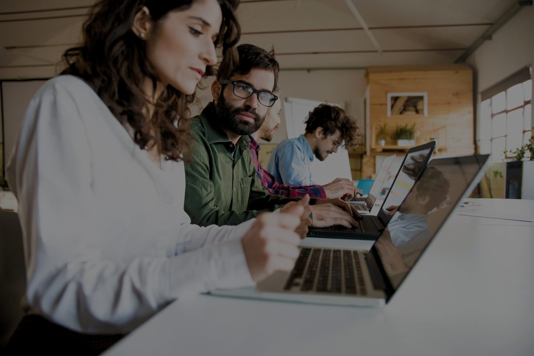 Corsentrix consultants collaborating in a modern office